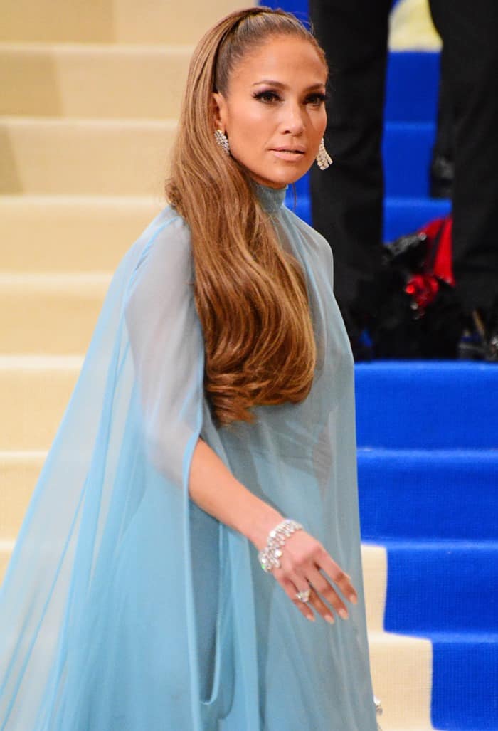 The sheer cape panels and fluid caftan-inspired silhouette highlighted the soft movement and dramatic proportions of Jennifer Lopez's custom Valentino ensemble