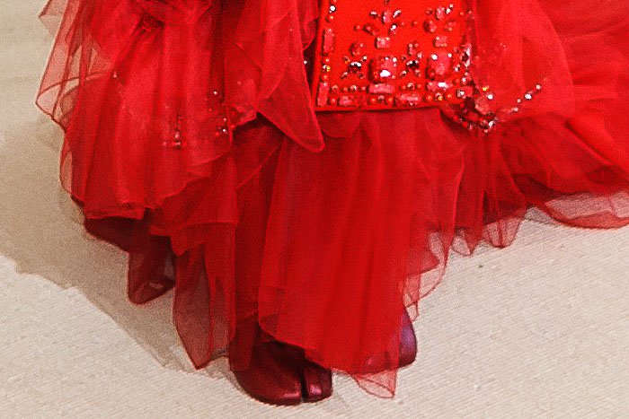 Katy Perry's controversial choice: Maison Margiela 'Tabi' boots, featuring the signature split-toe design, add a polarizing touch to her already standout Met Gala 2017 outfit