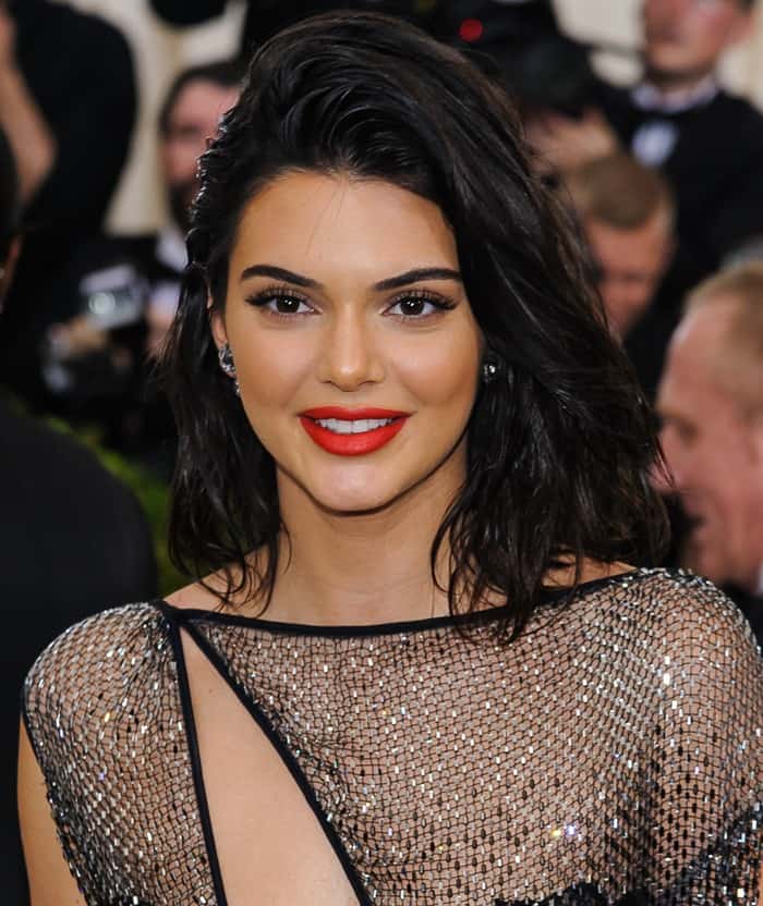 Kendall Jenner styled the barely-there dress with a painted macramé bodysuit