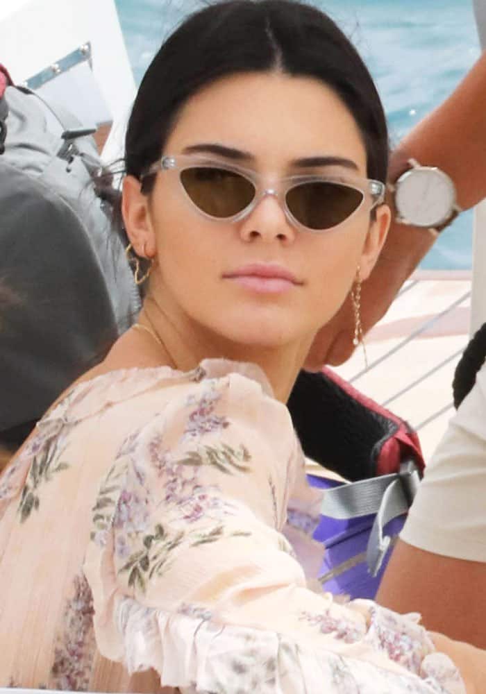 Kendall Jenner exudes effortless chic in a floral Zimmermann romper and stylish sunglasses while boating in Cannes