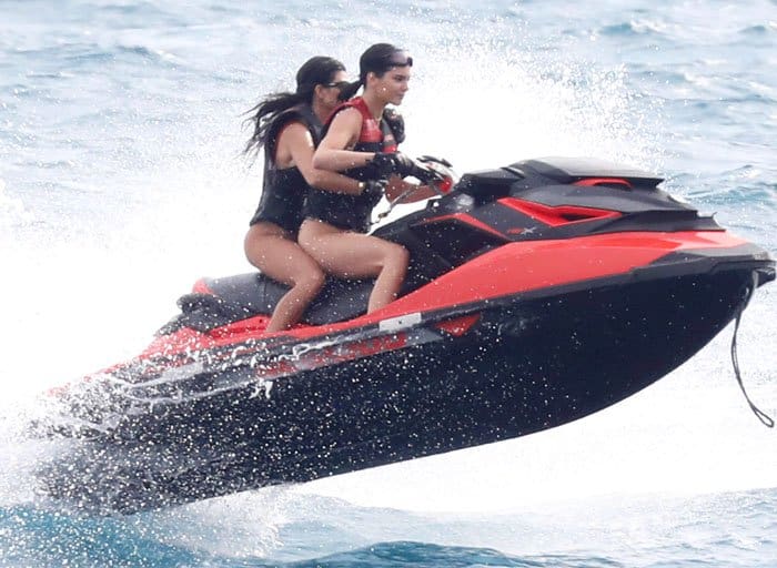 Kendall Jenner and her sister Kourtney Kardashian enjoy an exhilarating jetski ride in the waters of Cannes