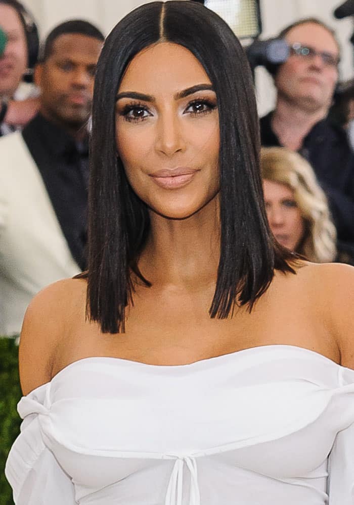 Kim Kardashian turns heads in a minimalist off-the-shoulder white Vivienne Westwood gown while arriving solo at the 2017 Met Gala in New York on May 1, 2017