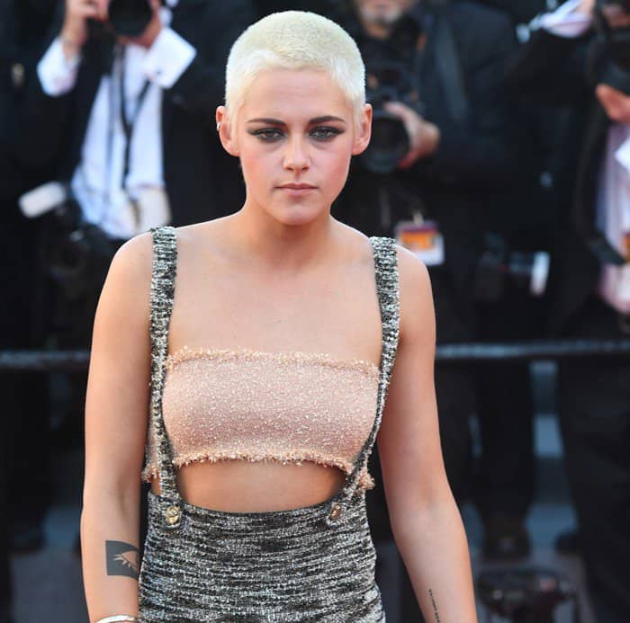 Kristen Stewart wearing a tweed pinafore ankle length dress