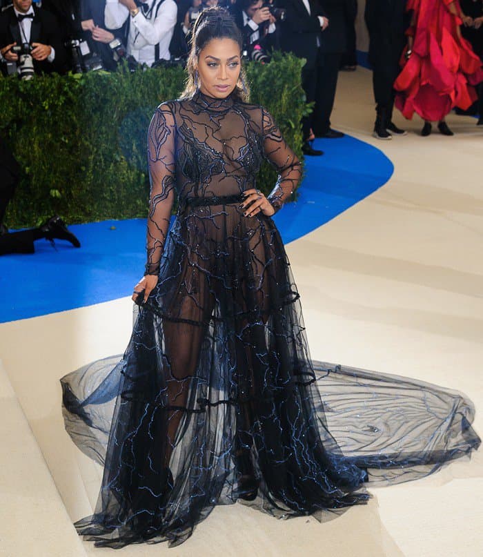 La La Anthony's Thai Nguyen Atelier gown with black diamond accents and sheer train