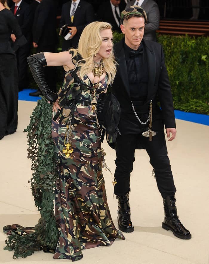 Madonna turned heads at the 2017 Met Gala in a full-length camouflage Moschino gown with combat boots, while Jeremy Scott matched in military-inspired black with lace-up patent boots