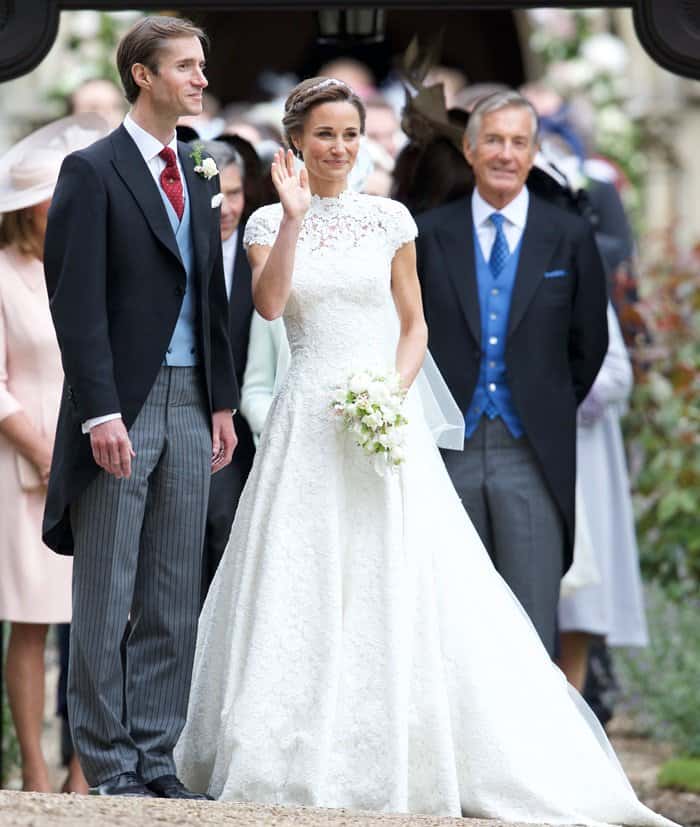 Pippa Middleton steps out at St. Mark’s Church in Englefield on May 20, 2017, her lace Giles Deacon gown concealing custom ivory satin Manolo Blahnik “Seneca” pumps that add subtle structure and sparkle beneath the hem