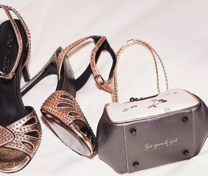 Selena Gomez’s custom Coach accessories, including her bronze studded ankle-strap sandals and a personalized clutch engraved with “love yourself first,” add a meaningful touch to her MET Gala ensemble