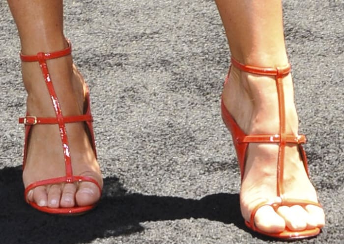 Annabelle Wallis completes her all-red Givenchy look with sleek T-strap red sandals