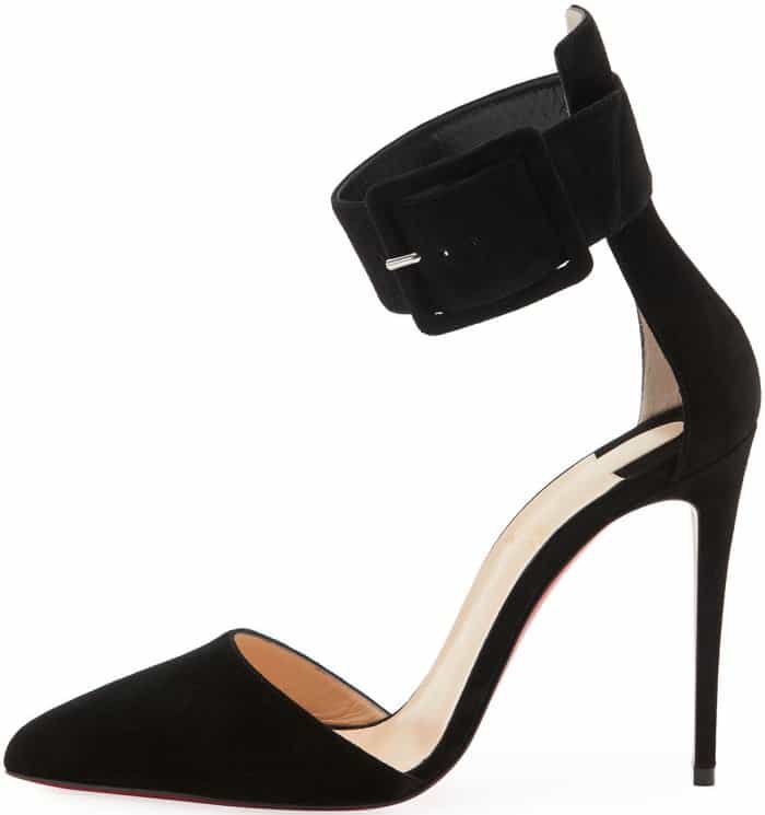 A sharply pointed toe, sculptural ankle cuff, and sky-high stiletto define the Christian Louboutin Harler pump, a black suede silhouette that blends restraint, edge, and unmistakable red-sole authority