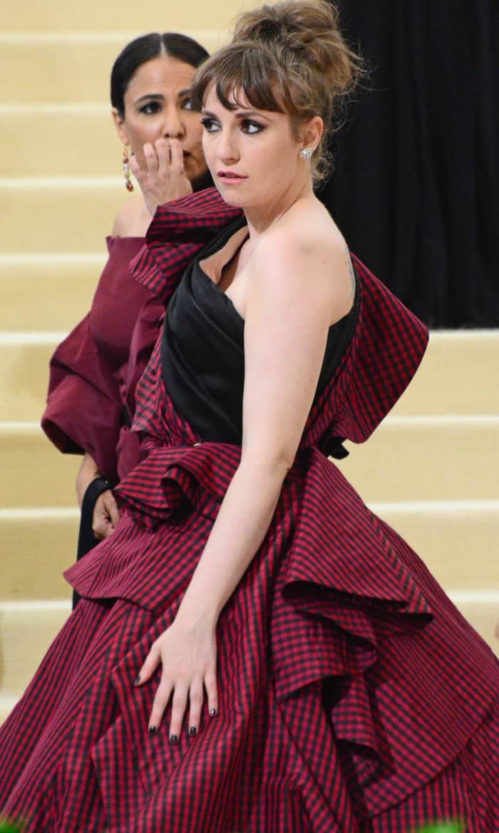 Lena Dunham wearing a custom Elizabeth Kennedy gown and Jeffrey Campbell lace-up boots at the 2017 Met Gala