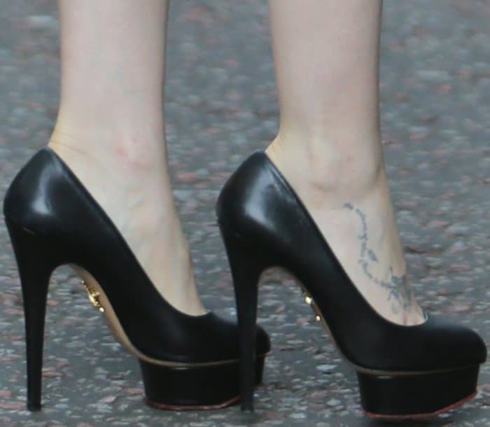 Lily Collins shows off her feet in Charlotte Olympia heels
