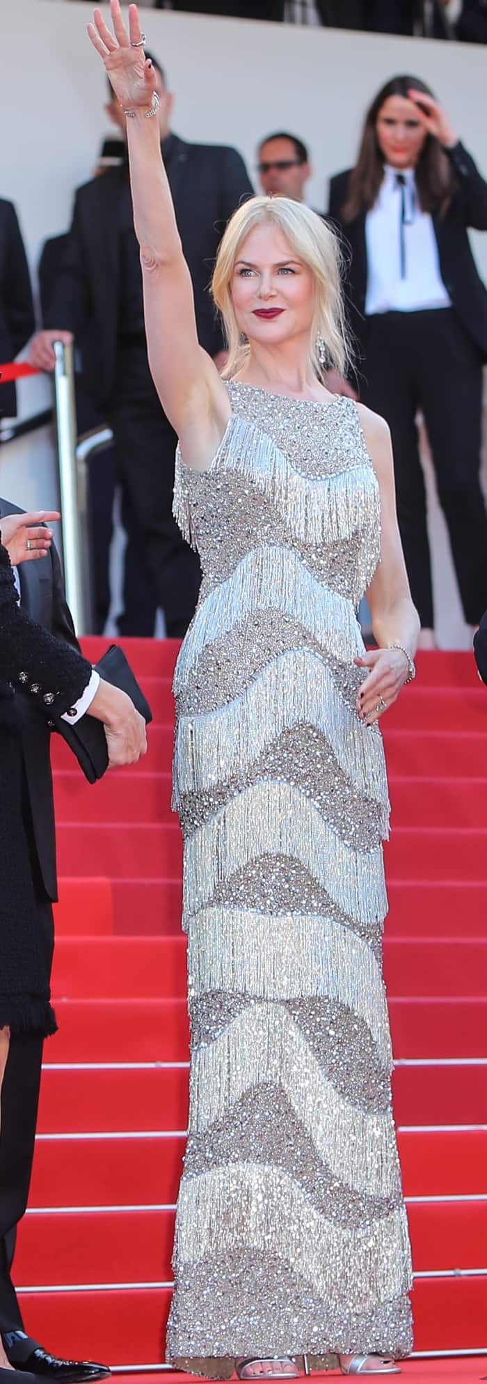 Wearing a shimmering Michael Kors Pre-Fall 2017 gown, Nicole Kidman waves from the Cannes steps in Gianvito Rossi silver Portofino sandals, finishing the look with whimsical Lydia Courteille rabbit earrings that add personality to the high-glam moment