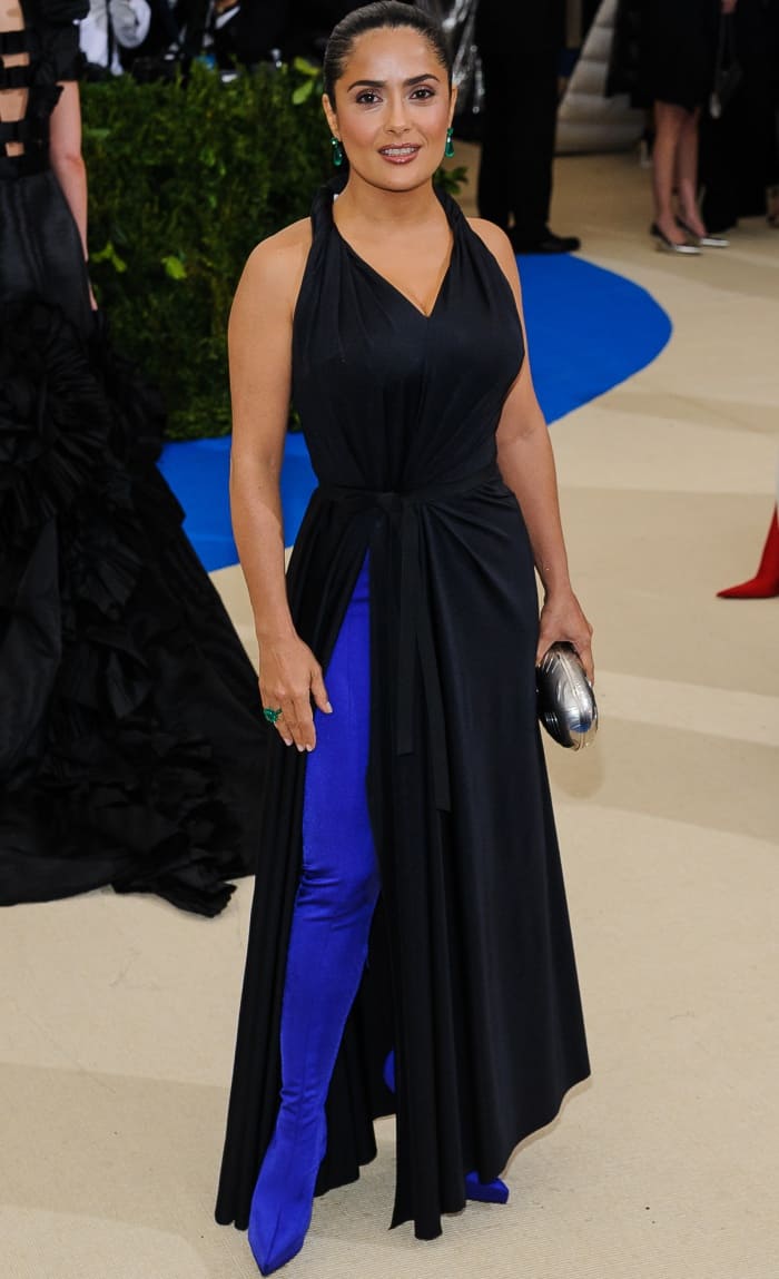 Salma Hayek in a sleeveless black dress with a V-shaped neckline