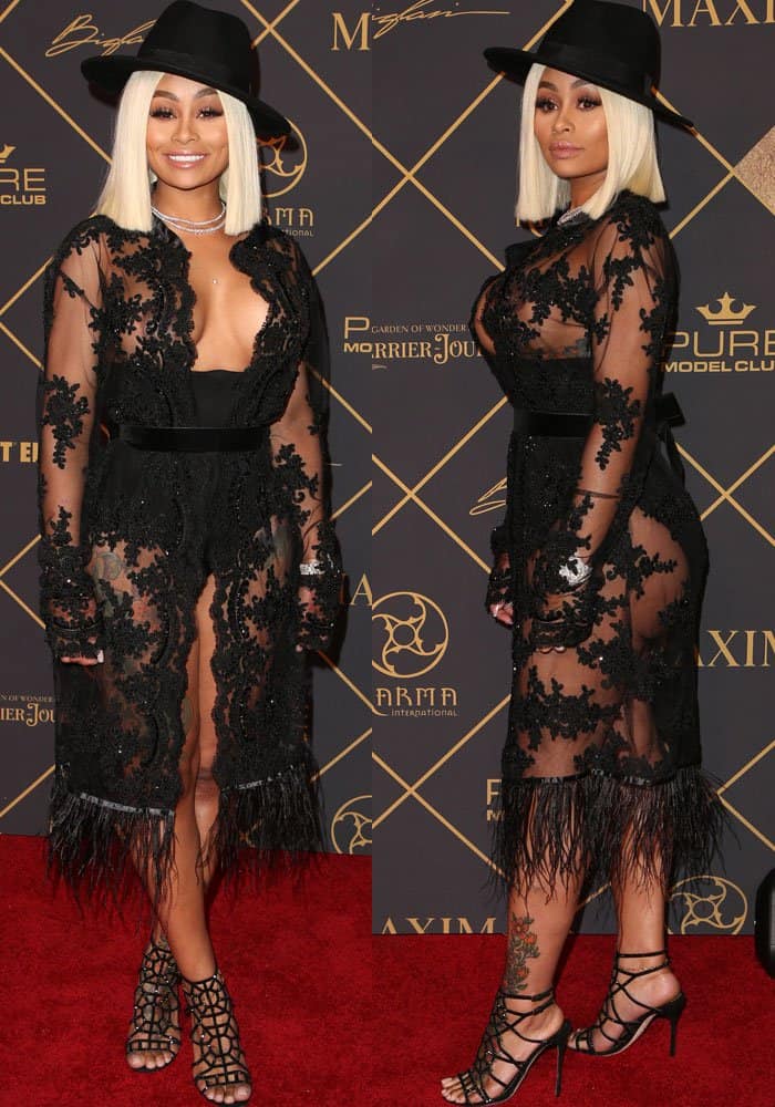 Blac Chyna shows the head-to-toe effect of her sheer embroidered Dare To Be Vintage dress, finished with a fringed hem and strappy Sergio Rossi “Puzzle” sandals