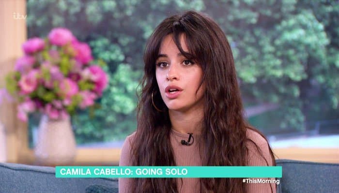 Appearing on ITV’s “This Morning,” Camila Cabello discussed life after Fifth Harmony while wearing a softly structured neutral dress that reflected her evolving personal style