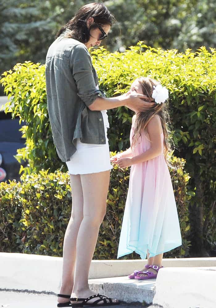 Gal Gadot stays effortlessly stylish in black studded flat sandals, while her daughter adds a playful touch with purple strappy sandals
