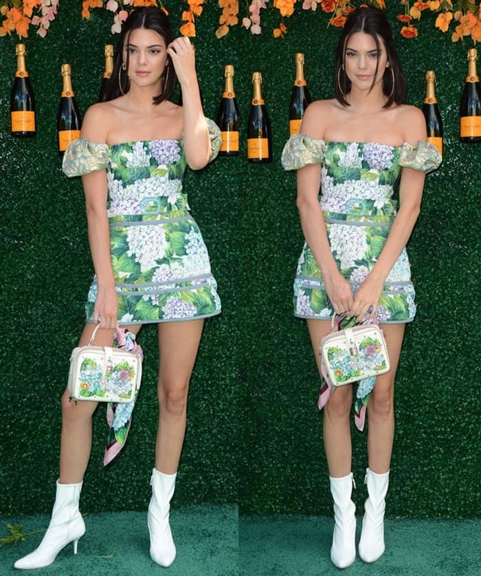 Kendall Jenner stunned in a Dolce  Gabbana off-the-shoulder hydrangea-print mini dress paired with white ankle booties and a floral-embellished box bag for a fresh, spring-ready look