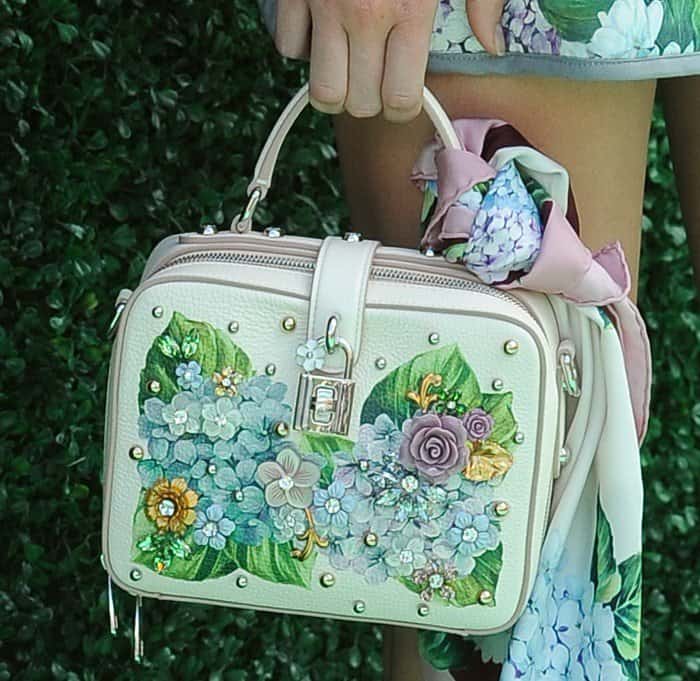 Kendall Jenner carried a Dolce  Gabbana box bag adorned with intricate floral appliqués, pearls, and crystals