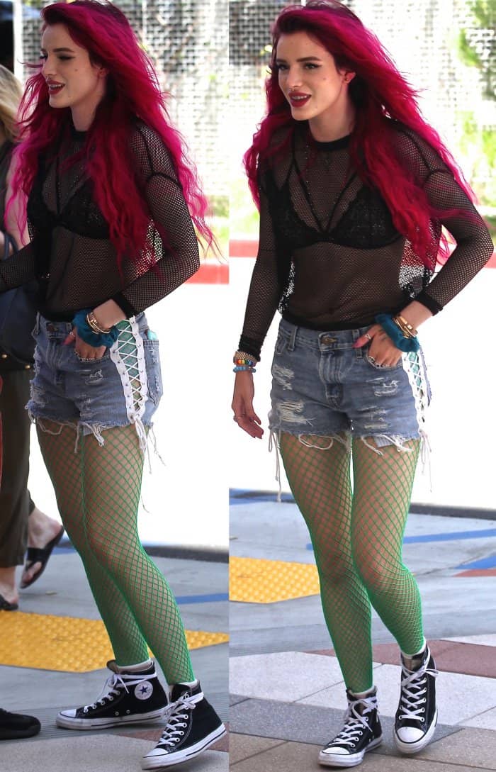 Bella Thorne wearing Converse Chuck Taylor All Star high top sneakers while out and about in LA
