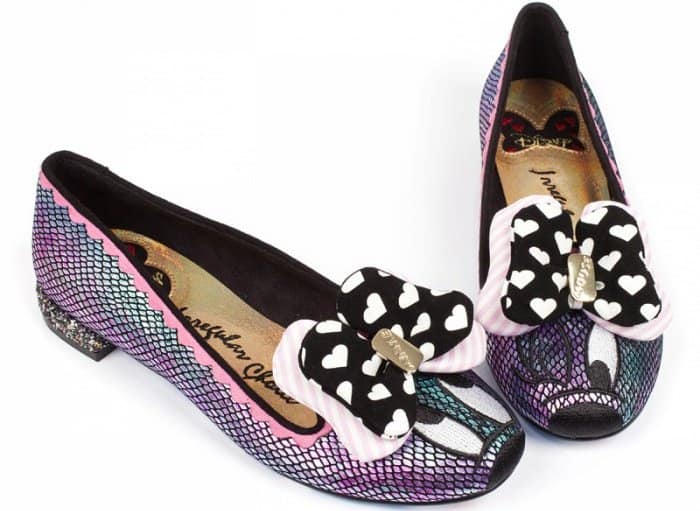 These shoes feature an iridescent oil slick effect, a slip-on style, and a Minnie Mouse embroidery detail