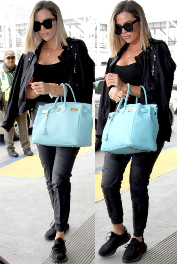 Khloé Kardashian in a low-cut top tucked into cropped sweatpants