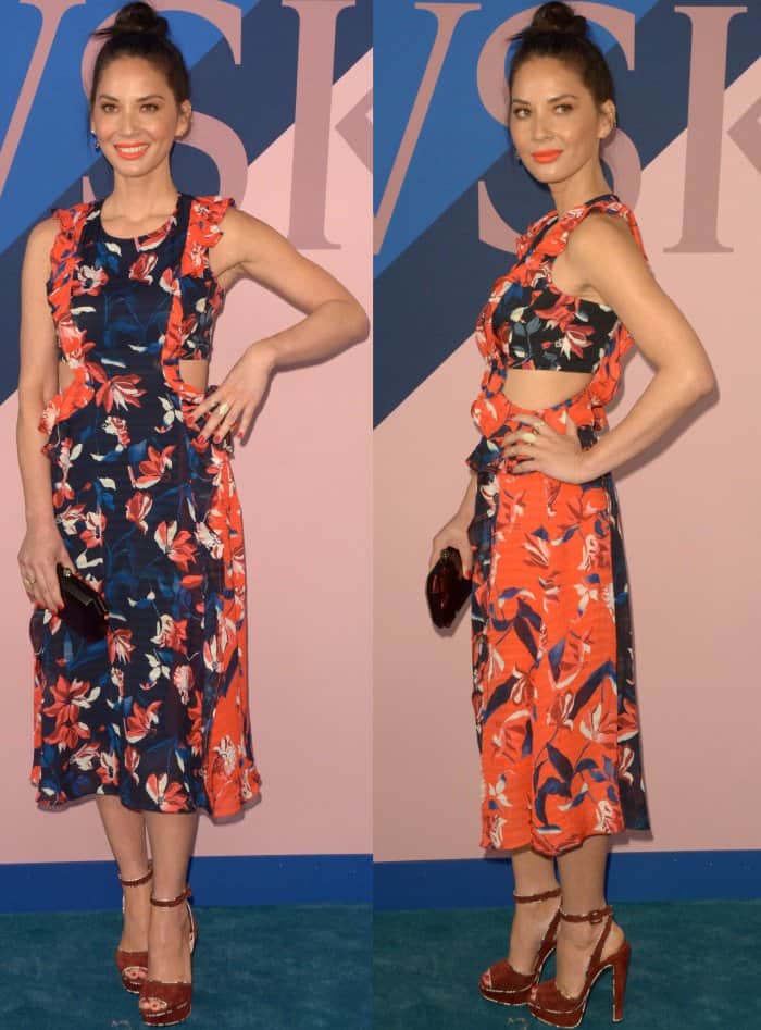 Olivia Munn’s Tanya Taylor dress features a vibrant floral pattern, playful cutouts, and ruffled accents