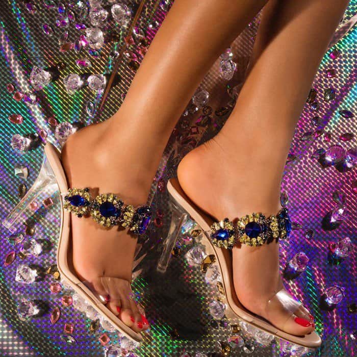 These barely-there sandals are lavishly adorned with blue Swarovski crystals on the front straps