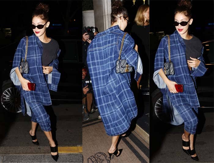 Bella Hadid perfectly pairs her Marcelo Burlon plaid pantsuit with sleek black leather Schutz "Quereda" mules, embodying off-duty model elegance