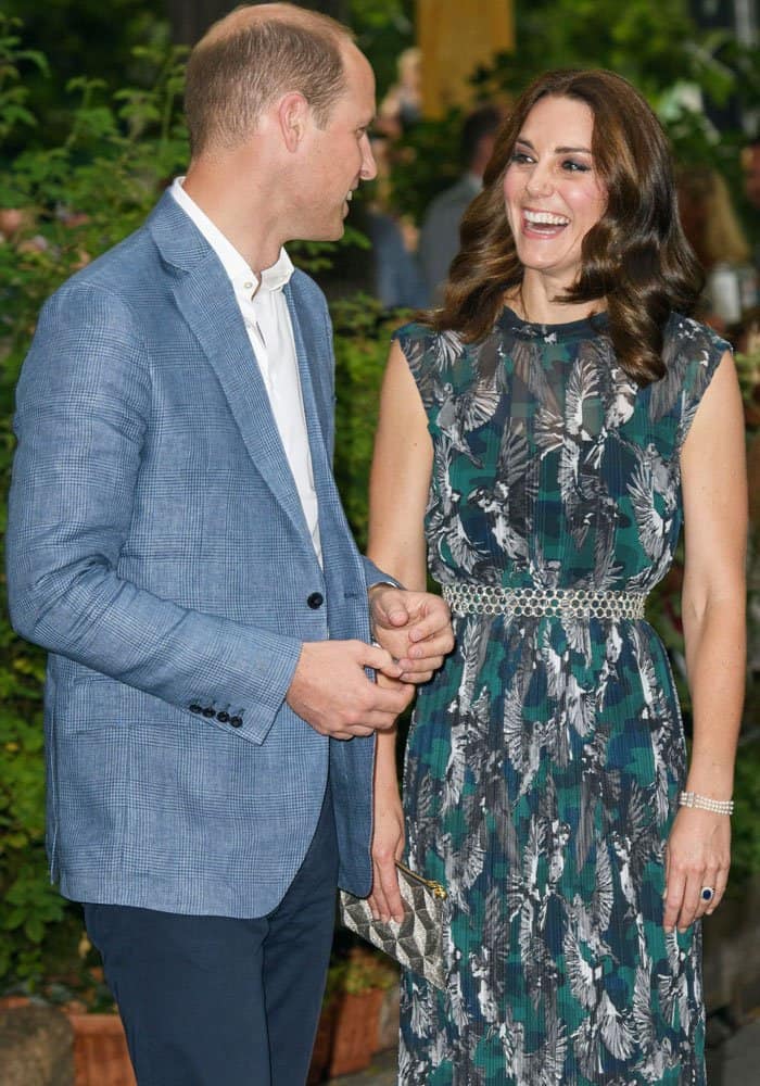 A candid moment: The Duke and Duchess of Cambridge share a hearty laugh during their tour of Clärchens Ballhaus