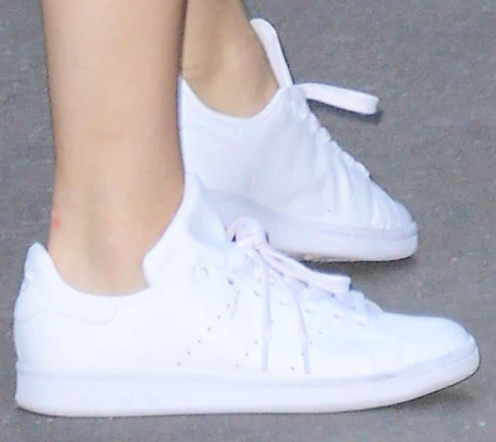 Kendall Jenner opted for her versatile white Adidas "Stan Smith" sneakers to complement her tailored shorts and blazer outfit