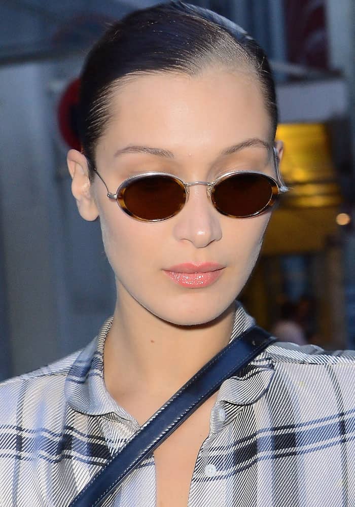 Bella Hadid maintained her composure amidst a flurry of camera flashes after exiting the Fendi show in Paris