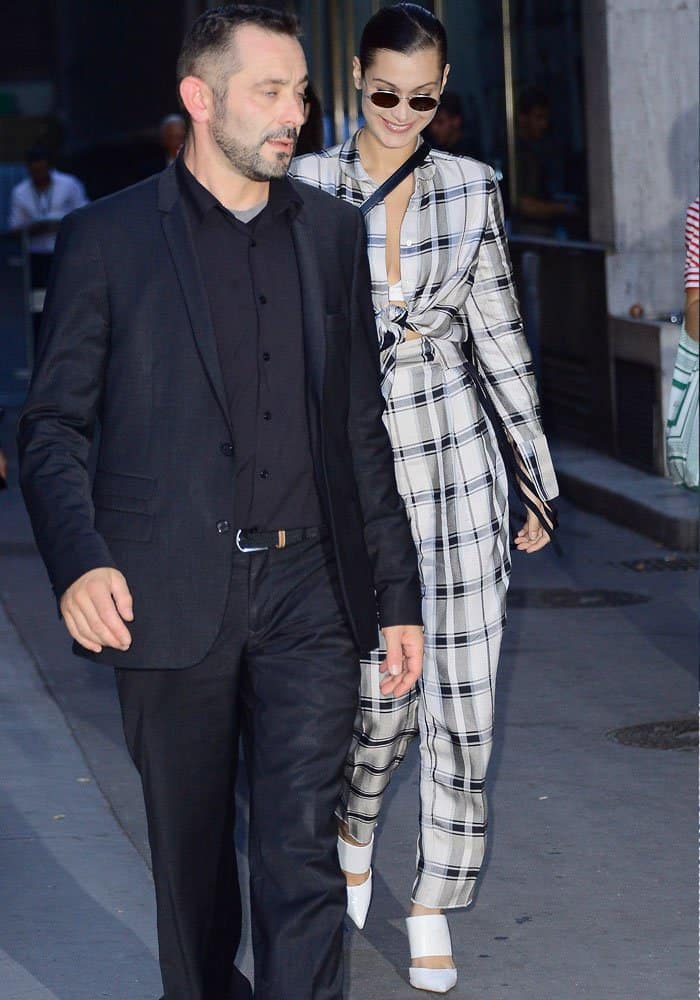 Bella Hadid broke into a smile as she made her way to her car after her appearance at the Fendi show