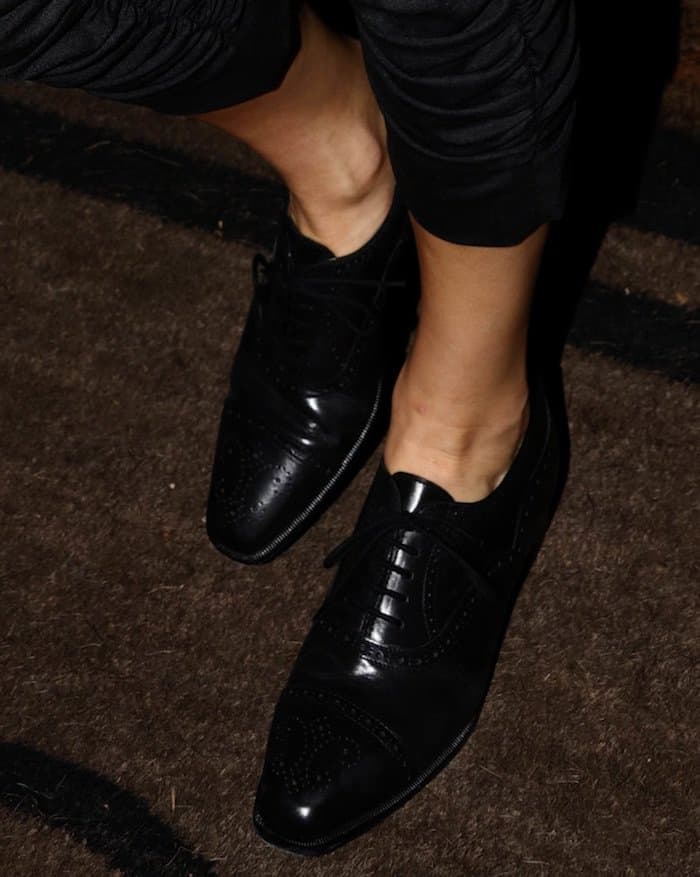 Kendall Jenner went for a more classic approach in an all-black pantsuit and Manolo Blahnik black lace-up oxfords