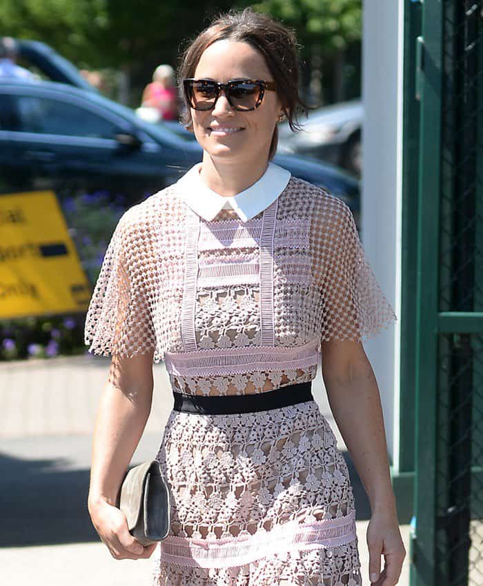 Pippa Middleton complements her Self-Portrait lace dress with oversized sunglasses, adding a chic yet understated touch to her Wimbledon look
