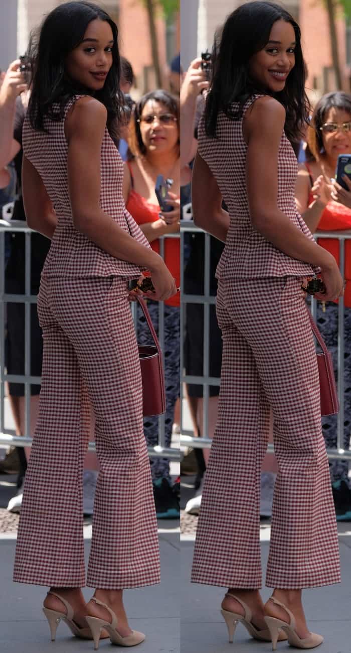 From the back, Laura Harrier’s tailored gingham set showcases a flawless fit, complemented by nude slingback heels that elongate her frame with effortless sophistication