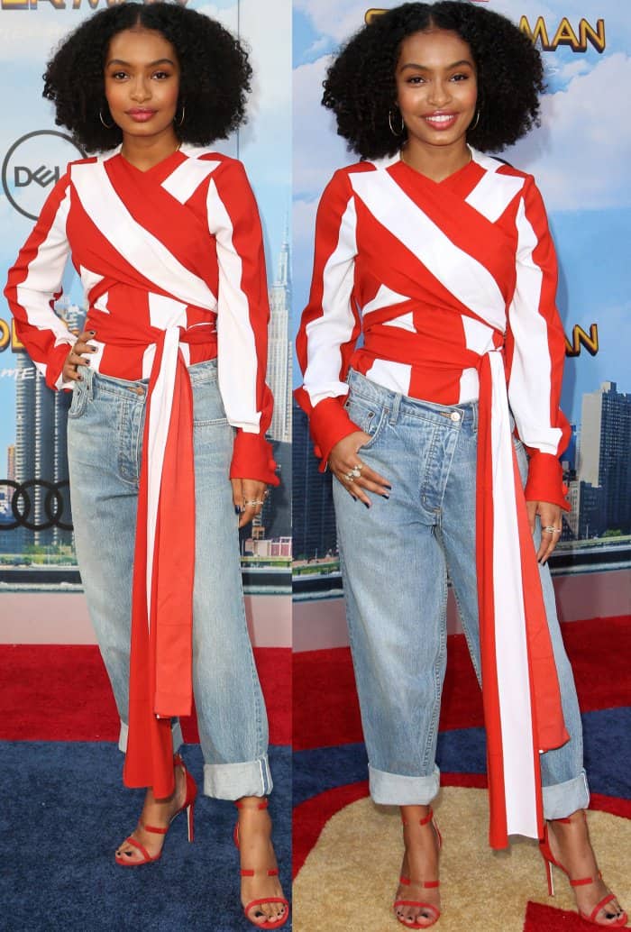 Yara Shahidi stuns in a bold Monse red-and-white wrap blouse, paired with boyfriend jeans and vibrant red Tamara Mellon 'Reverse Frontline' sandals