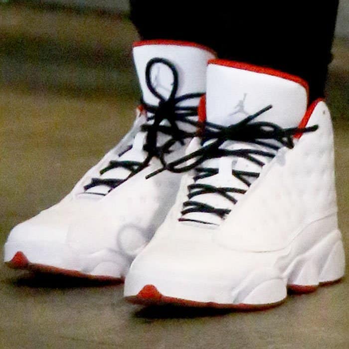 Blac Chyna wears the iconic Nike Air Jordan 13 Retro, a classic silhouette known for its distinctive quilted upper and a holographic "cat's eye" logo