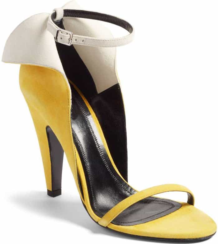 Add a fun, tropical feel to your look with this a-peeling sandal featuring a split counter and svelte ankle and toe straps