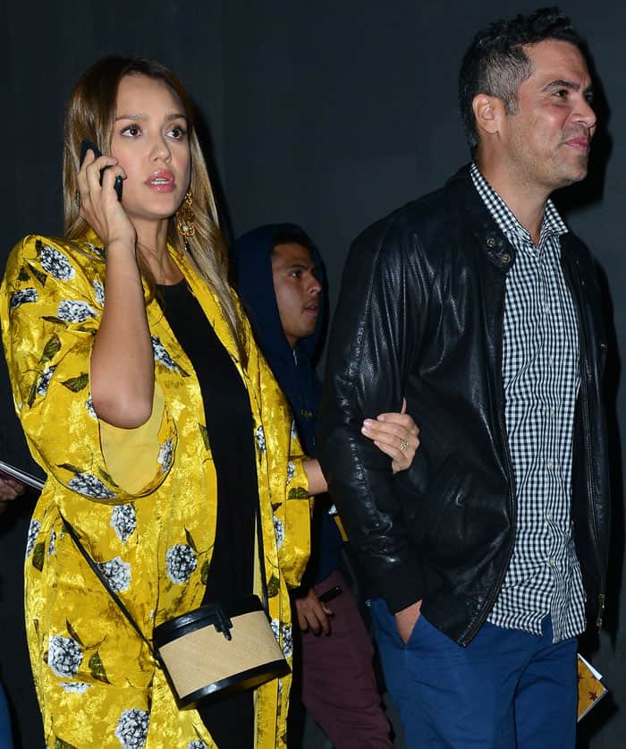 Jessica Alba leaves the Pantages Theatre arm-in-arm with her then-husband Cash Warren