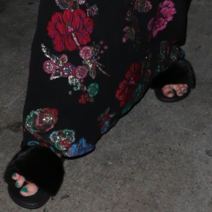 Jessica Simpson flaunts her teal pedicure while stepping out in chic black fur sandals
