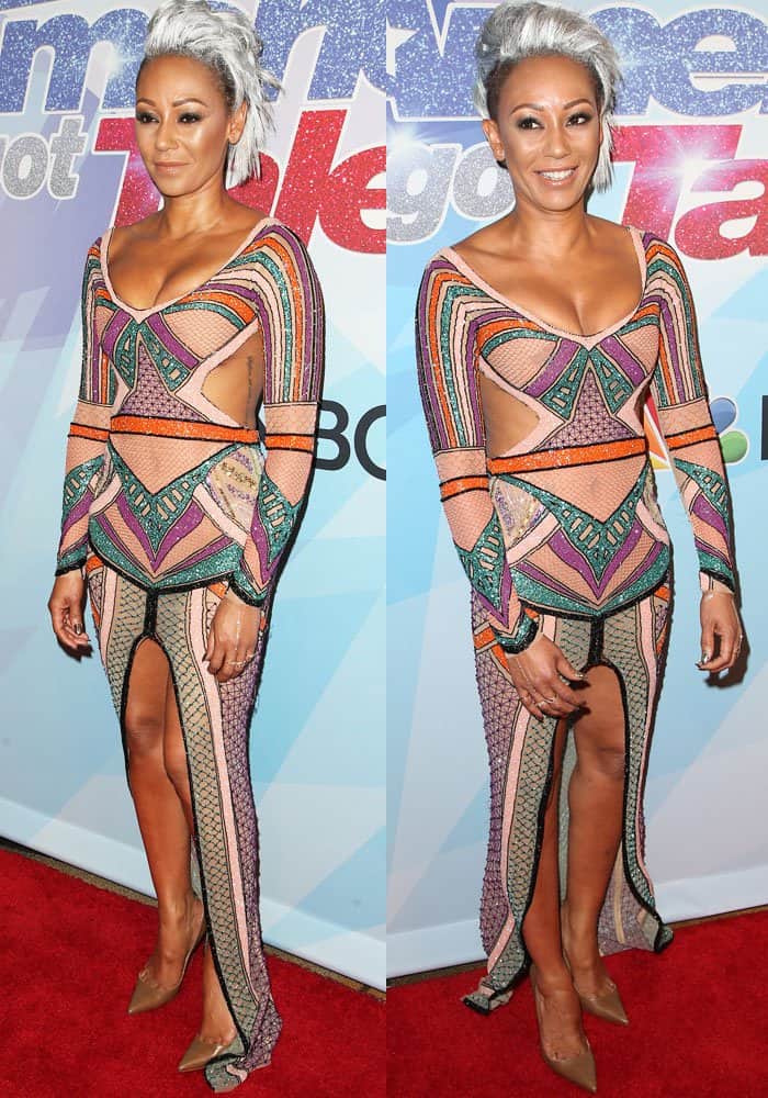 Despite the on-air confrontation earlier in the night, Mel B confidently poses post-show, letting the gown’s sheer panels, thigh-high slit, and sculpted silhouette take center stage