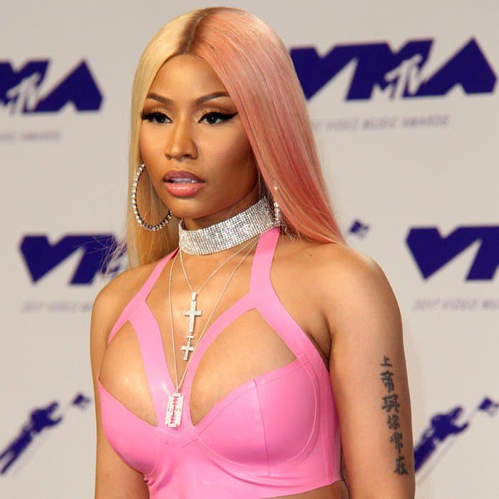 Nicki Minaj accessorized with Djula diamond rings and choker (priced at $226,000) and Harry Kotlar diamond rings worth over $500,000