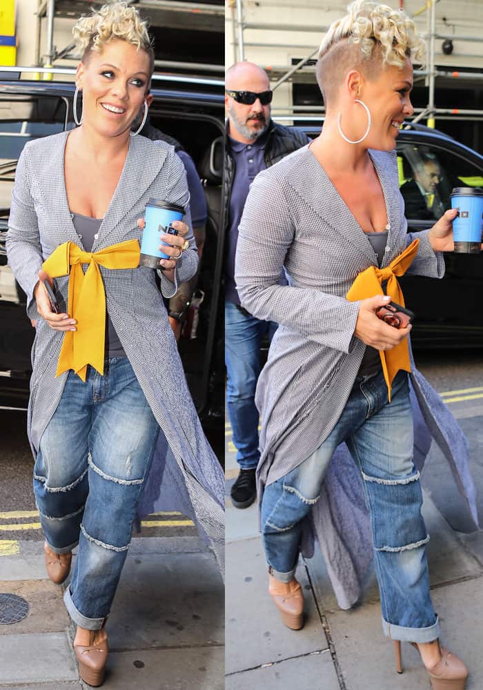 The petite pop star styled her checked trench and mustard bow with cuffed jeans and nude Gucci platform heels for a cool, off-duty vibe