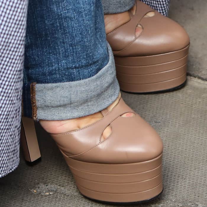 A closer look at Pink’s blush-toned Gucci “Angel” Mary Jane pumps, featuring stacked platforms and curved cutouts