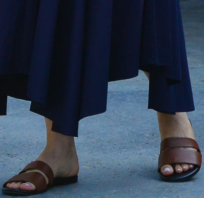 Emmy Rossum wearing brown leather slides at Jennifer Klein's 19th Annual Day of Indulgence Party