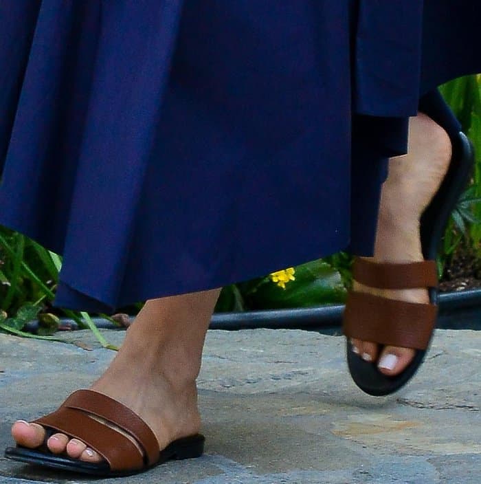 Emmy Rossum wearing brown leather slides at Jennifer Klein's 19th Annual Day of Indulgence Party