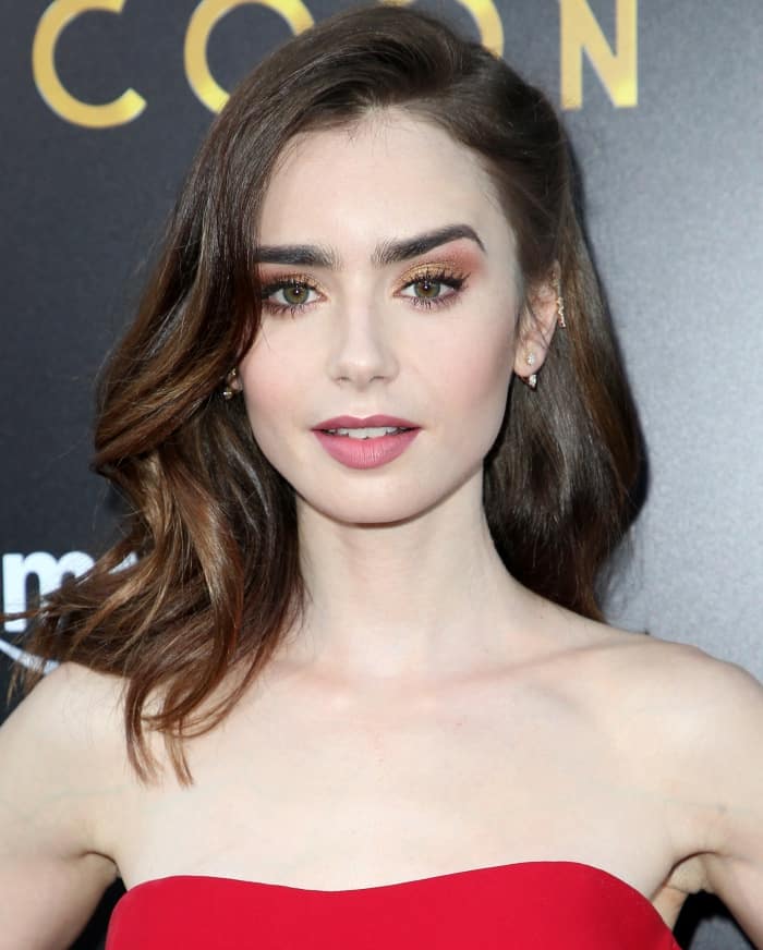 Close-up of Lily Collins in soft pink lipstick, vintage waves, and diamond earrings at The Last Tycoon premiere