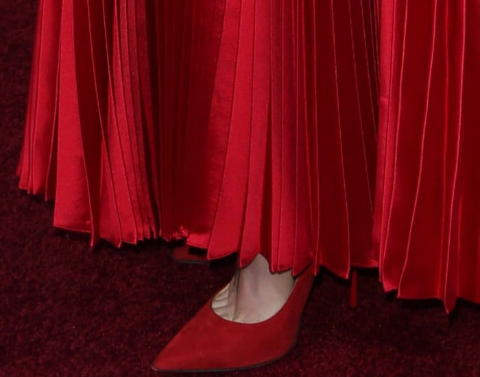 Close-up of Lily Collins' red suede Jimmy Choo pointy-toe pumps on the red carpet at The Last Tycoon premiere