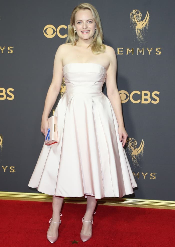 Elisabeth Moss stuns in a strapless blush pink Atelier Prabal Gurung midi dress paired with matching Olgana Paris “L’Attachante” ankle-tie pumps