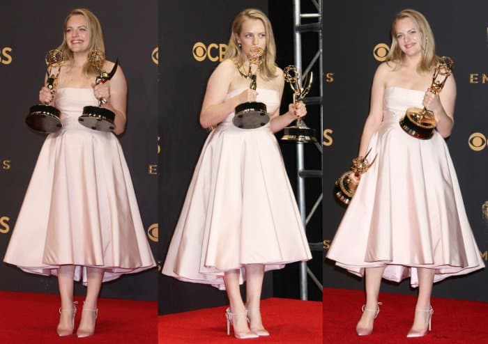 Elisabeth Moss shows off her awards at the 69th Annual Emmy Awards